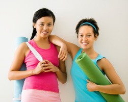 Women with yoga mats